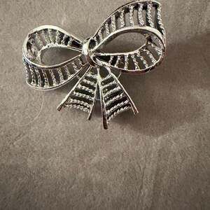 Bow Brooch Tied Rope Texture Metal Silver Tone -Miriam